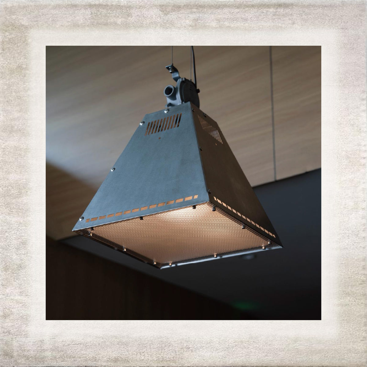 Officina tapered metal pendant light in an interior